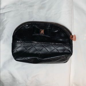 4in x 6in black makeup bag with gold accents